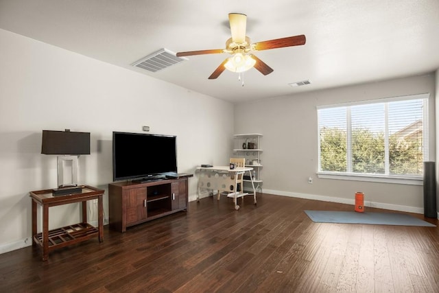 interior space with ceiling fan and dark hardwood / wood-style floors