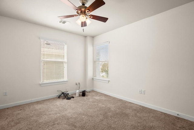 empty room featuring ceiling fan and carpet floors