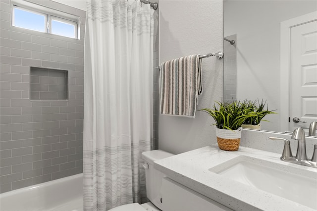 full bathroom with shower / bath combo with shower curtain, vanity, and toilet