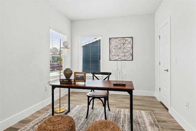 home office with wood-type flooring