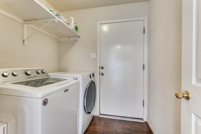 laundry room featuring independent washer and dryer and dark wood-type flooring