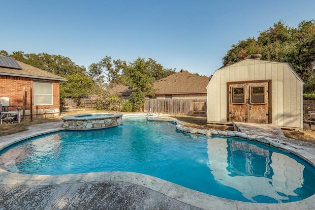 view of pool with a storage unit and an in ground hot tub