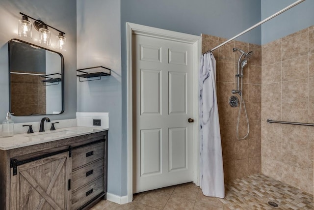 bathroom with tile patterned floors, curtained shower, and vanity