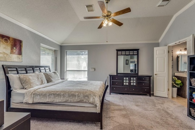 bedroom with ceiling fan, crown molding, light colored carpet, and vaulted ceiling
