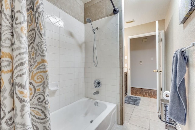 bathroom with vanity, tile patterned flooring, and shower / bathtub combination with curtain