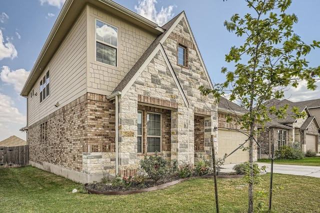 view of side of home featuring a yard and a garage