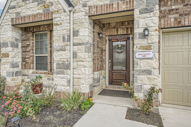 view of exterior entry featuring a garage