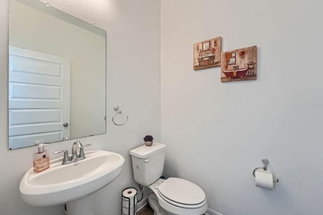 bathroom featuring sink and toilet