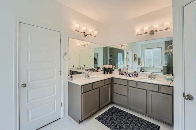 bathroom with a shower with door and vanity