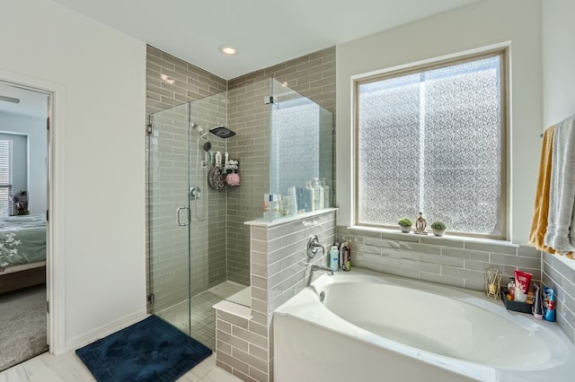 bathroom with plenty of natural light, plus walk in shower, and tile patterned floors