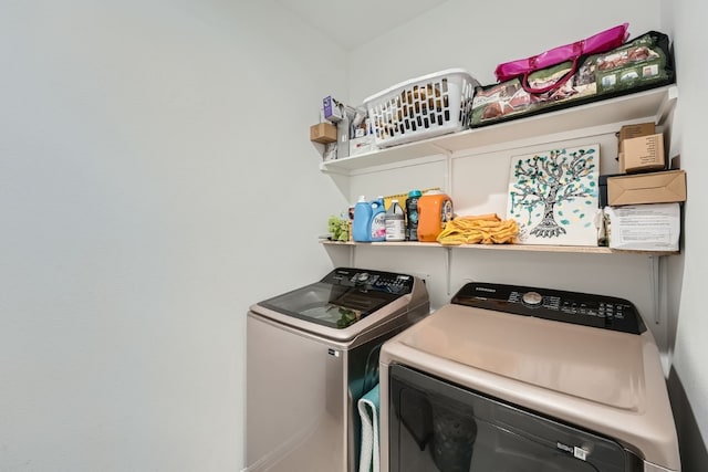 washroom with independent washer and dryer