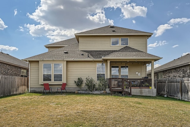 back of house featuring a yard