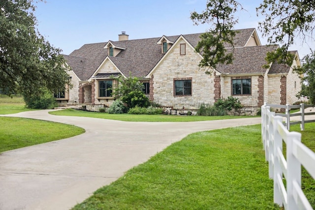 view of front of home with a front lawn