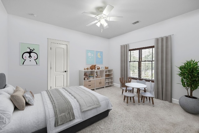 carpeted bedroom featuring visible vents, baseboards, and a ceiling fan