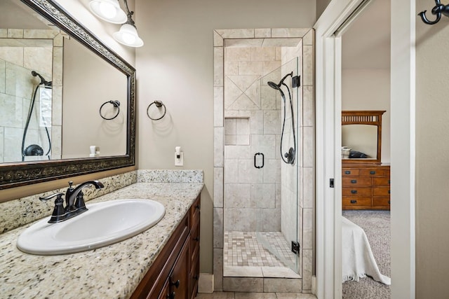 full bathroom with a stall shower and vanity