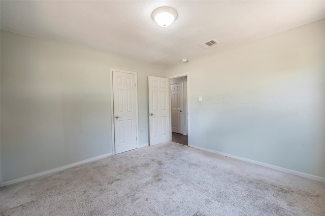 spare room with light carpet