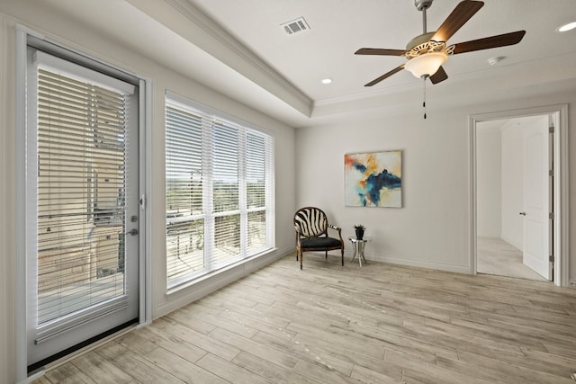 sitting room featuring ceiling fan, light hardwood / wood-style flooring, and crown molding