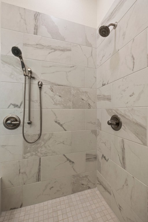 bathroom with tiled shower