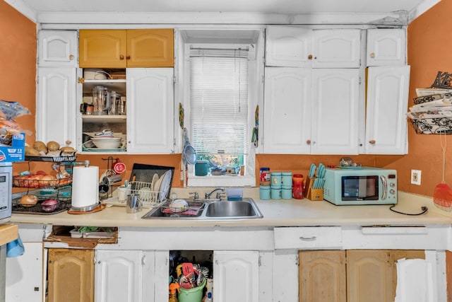 kitchen with white cabinets and sink