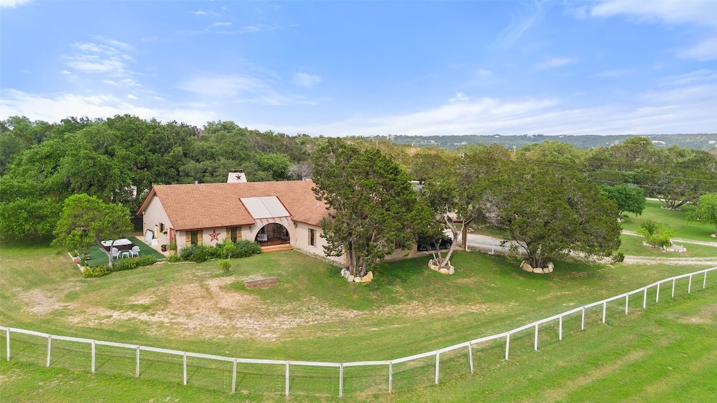 birds eye view of property with a rural view