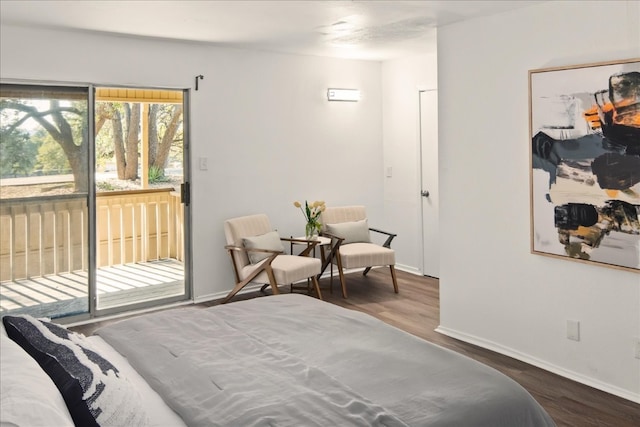 bedroom with access to outside and wood-type flooring