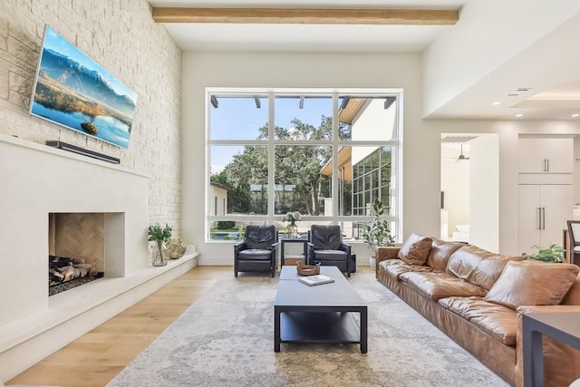 501 Delayne Dr, Austin, TX 78737 - living room with a fireplace, wood finished floors, and beamed ceiling