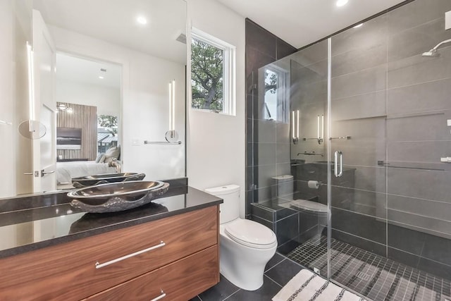 501 Delayne Dr, Austin, TX 78737 - full bathroom with vanity, a stall shower, ensuite bath, tile patterned flooring, and recessed lighting