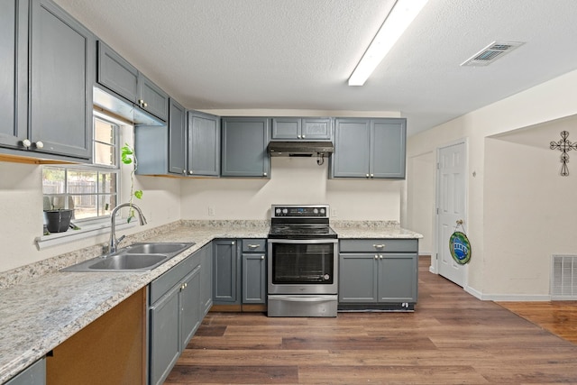 kitchen with gray cabinetry, electric range, sink, and dark hardwood / wood-style flooring