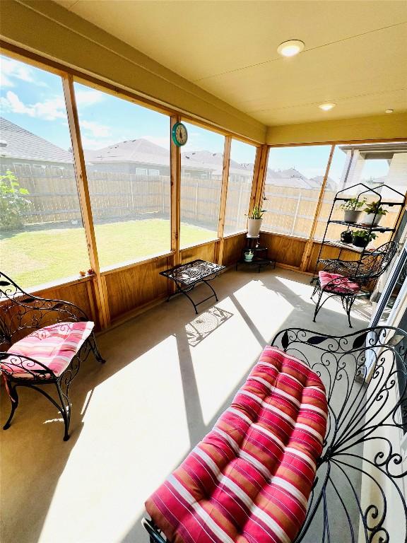 sunroom with a mountain view and a wealth of natural light