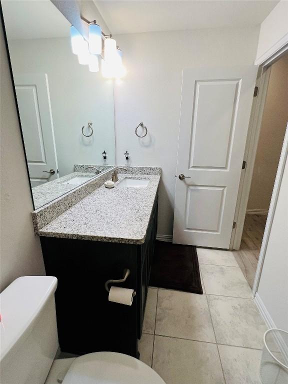 bathroom with vanity and tile patterned flooring