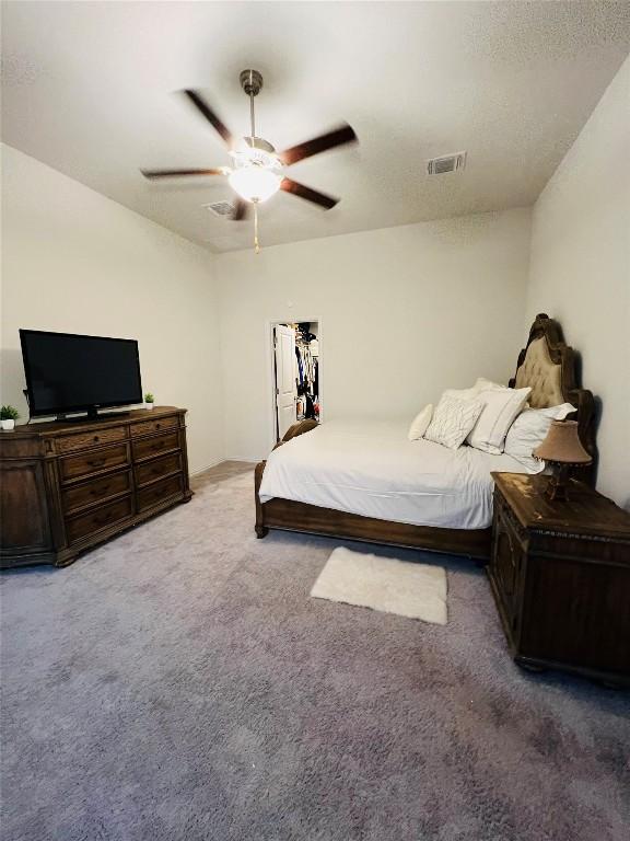 carpeted bedroom with ceiling fan