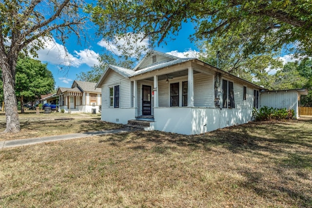 bungalow-style home with a front yard