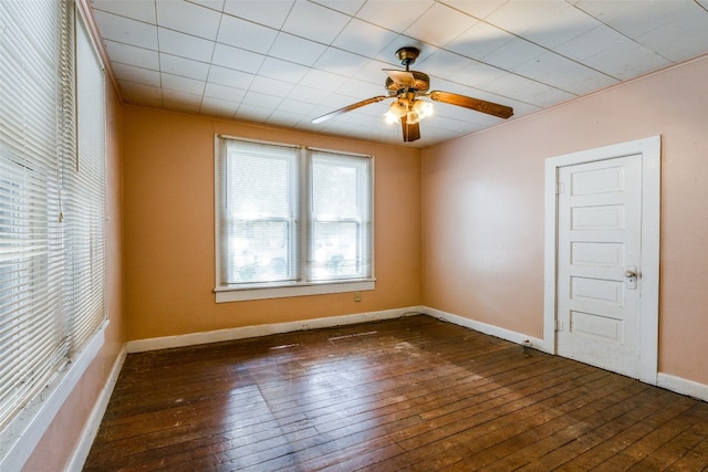 unfurnished room featuring dark hardwood / wood-style floors and ceiling fan