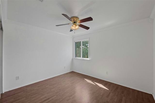 unfurnished room with crown molding, ceiling fan, and dark hardwood / wood-style floors