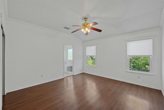 spare room featuring plenty of natural light, dark hardwood / wood-style floors, and ceiling fan