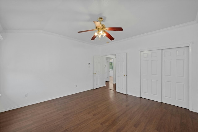 unfurnished bedroom featuring crown molding, vaulted ceiling, dark hardwood / wood-style flooring, and ceiling fan