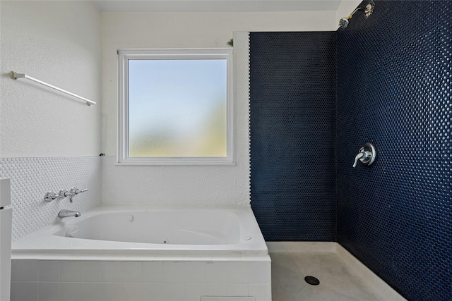 bathroom with separate shower and tub