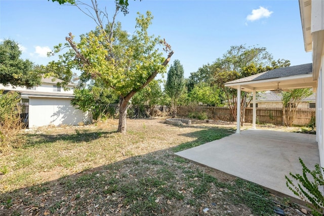 view of yard featuring ceiling fan and a patio area