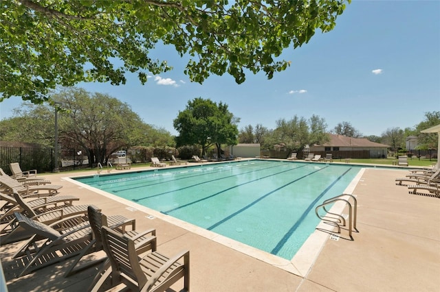 view of swimming pool with a patio area