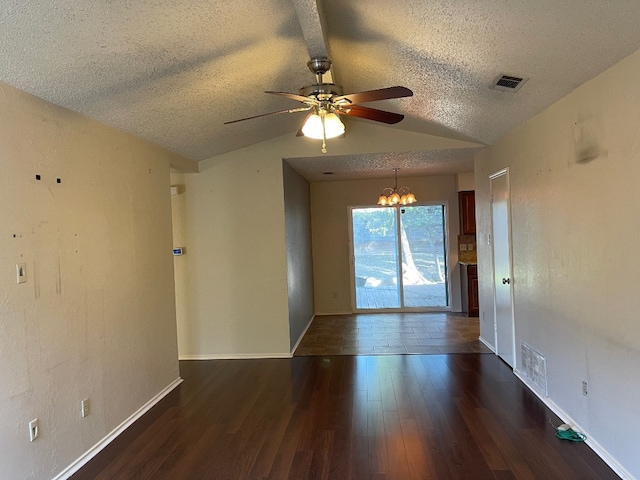 unfurnished room with a textured ceiling, lofted ceiling, ceiling fan with notable chandelier, and dark hardwood / wood-style flooring