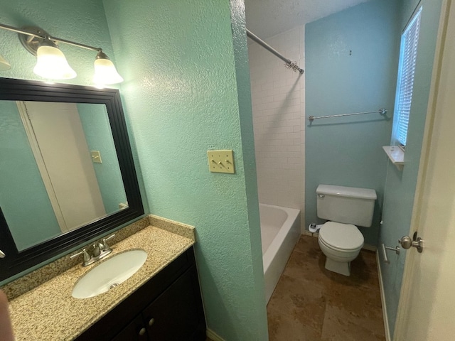 full bathroom with tiled shower / bath combo, vanity, and toilet