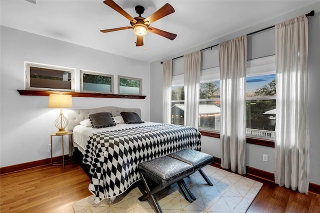 bedroom featuring ceiling fan and wood-type flooring