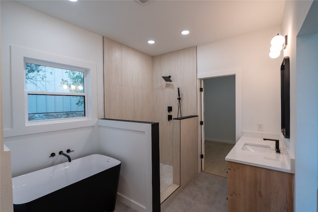 bathroom with plus walk in shower and vanity