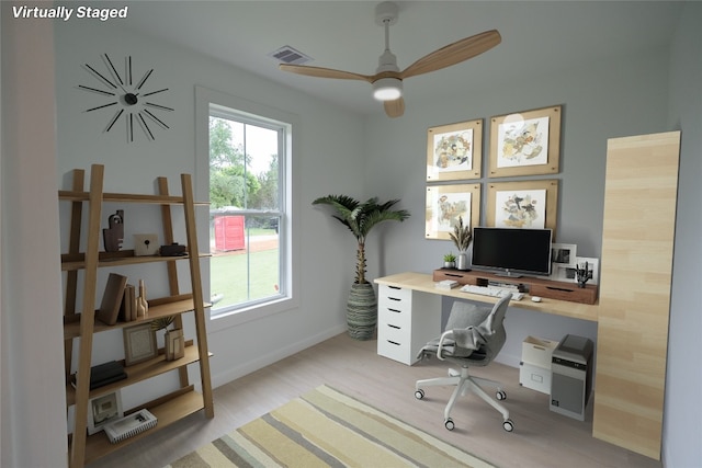 office area featuring light hardwood / wood-style floors and ceiling fan