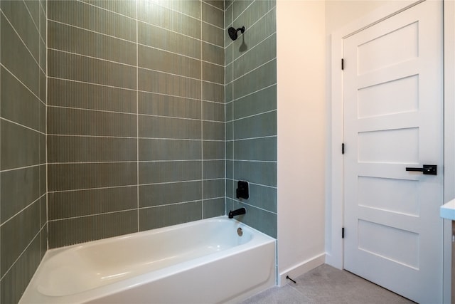 bathroom featuring tiled shower / bath