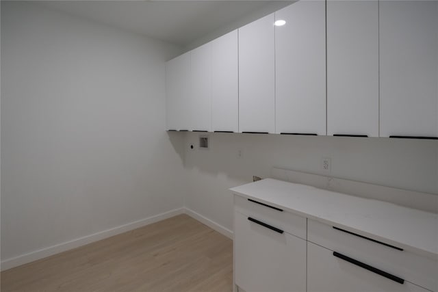 spacious closet featuring light hardwood / wood-style flooring