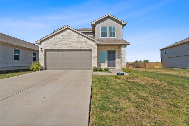 craftsman-style home featuring a front yard and a garage