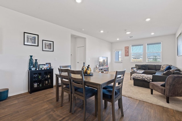 dining area with dark hardwood / wood-style floors