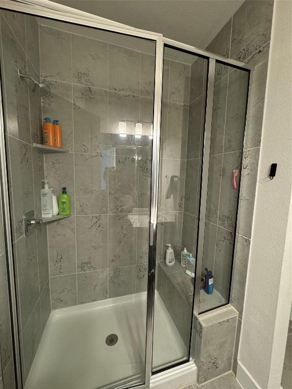 bathroom with an enclosed shower