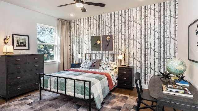 bedroom with ceiling fan and dark wood-type flooring